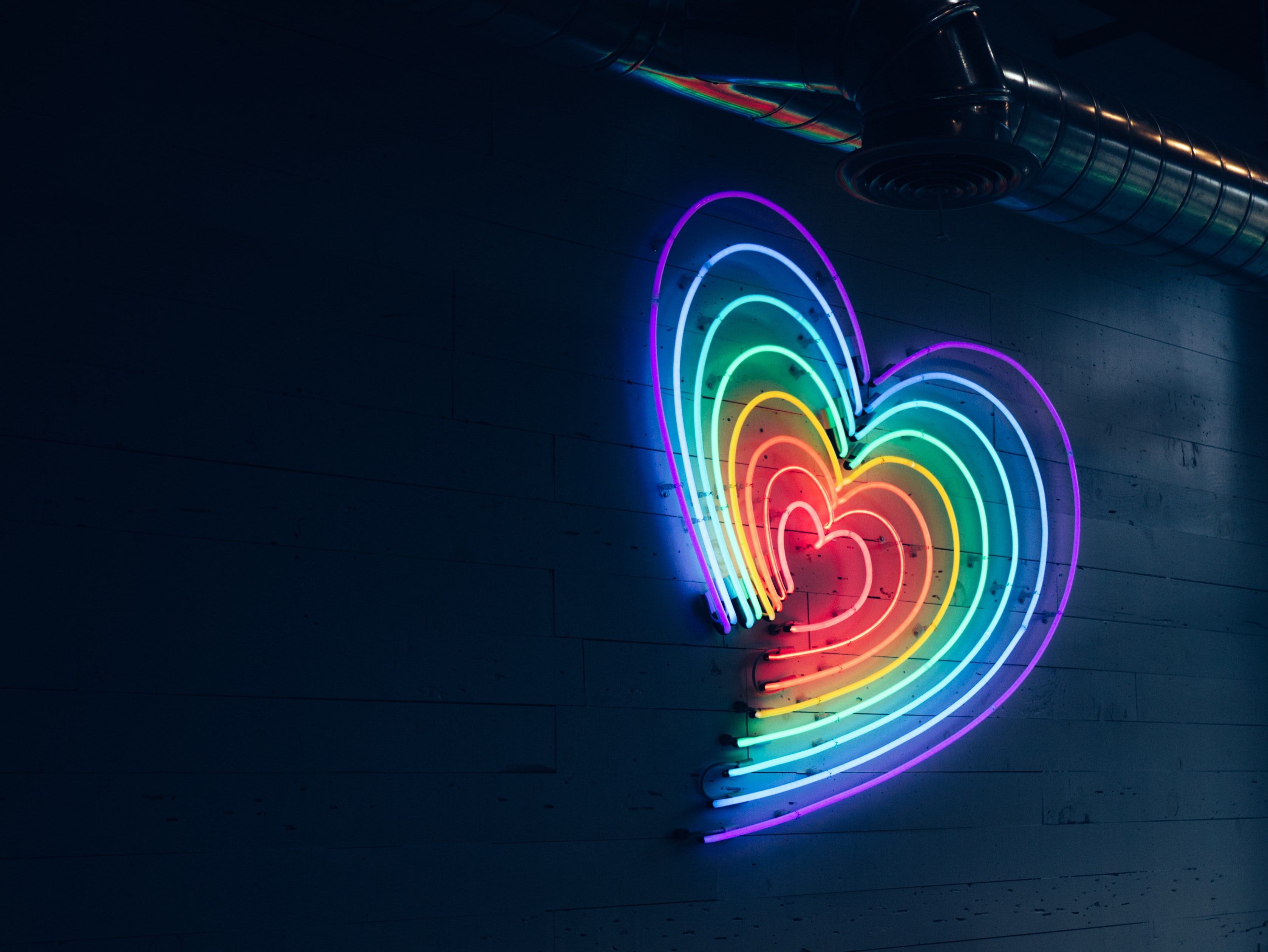 Multicolored heart LED light on wall Multicolored heart LED light on wall