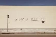 Wall with the tag "no one is illegal" 