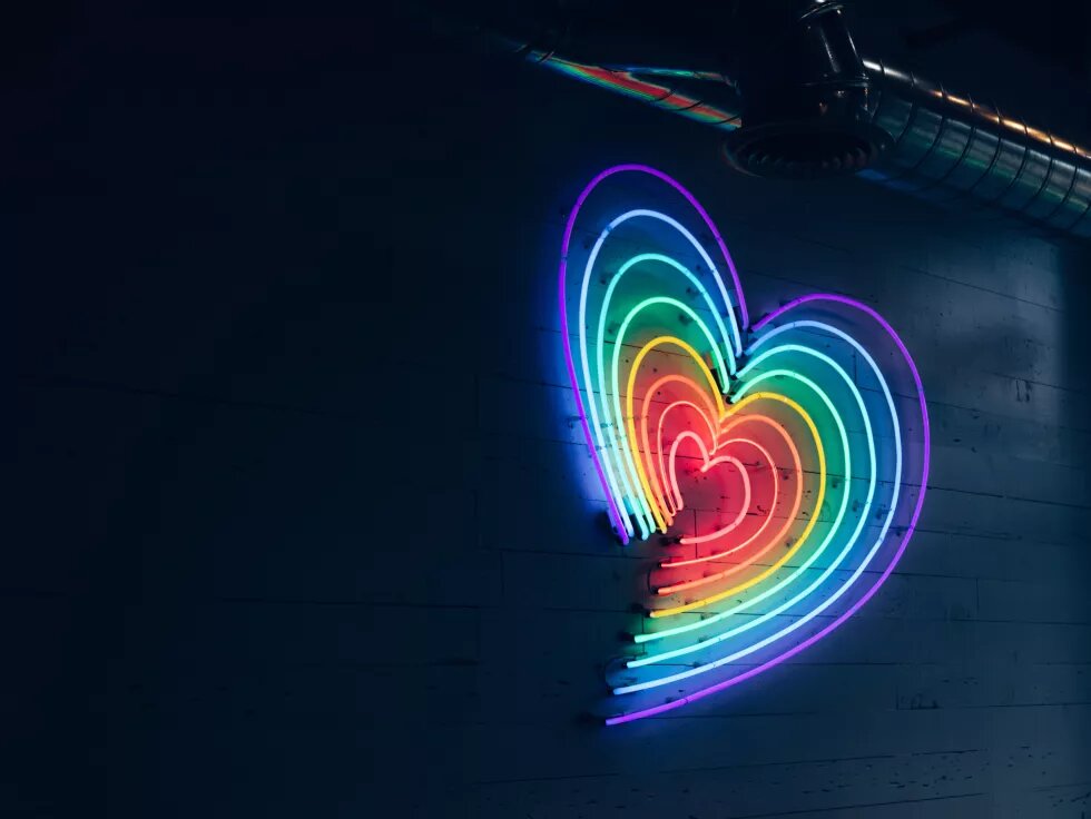 Multicolored heart LED light on wall