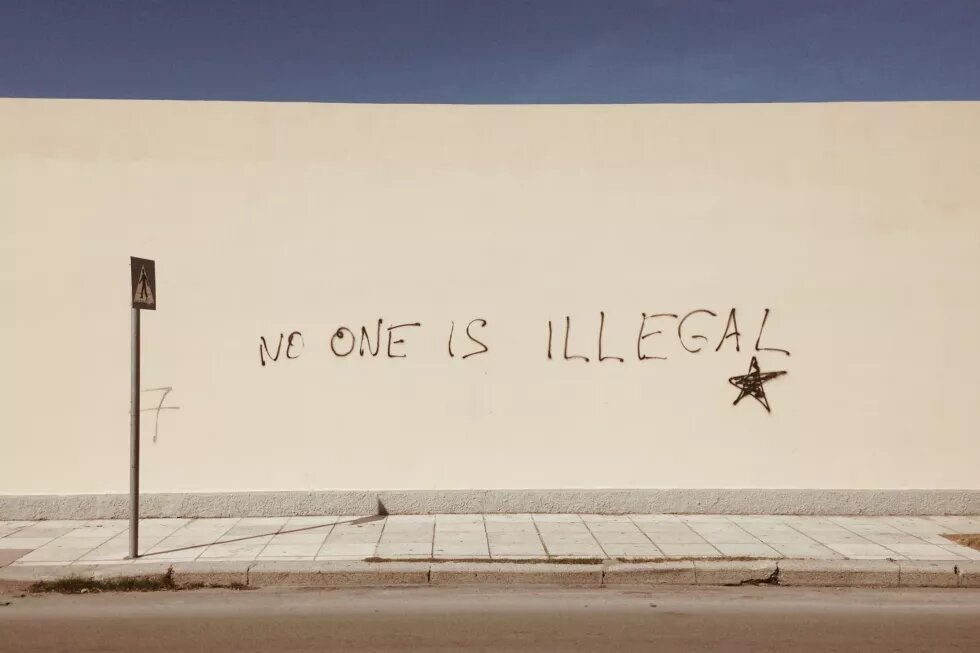 Wall with the tag "no one is illegal" 