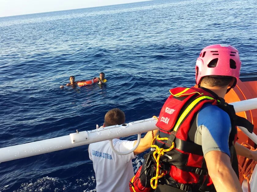 The Italian coastguard rescuing two refugees from Africa in Lampedusa