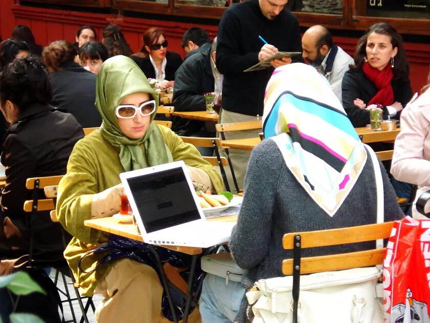 Two young Muslim women in the heart of Istanbul with their laptop