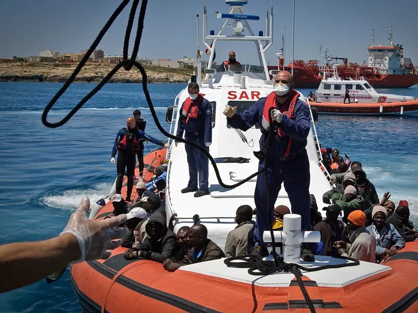 An Italian coastguard vessel prepares to dock in Lampedusa’s port.