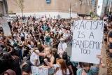 "Racism is a pandemic too" Sign at Black Lives Matter demonstration in Montreal