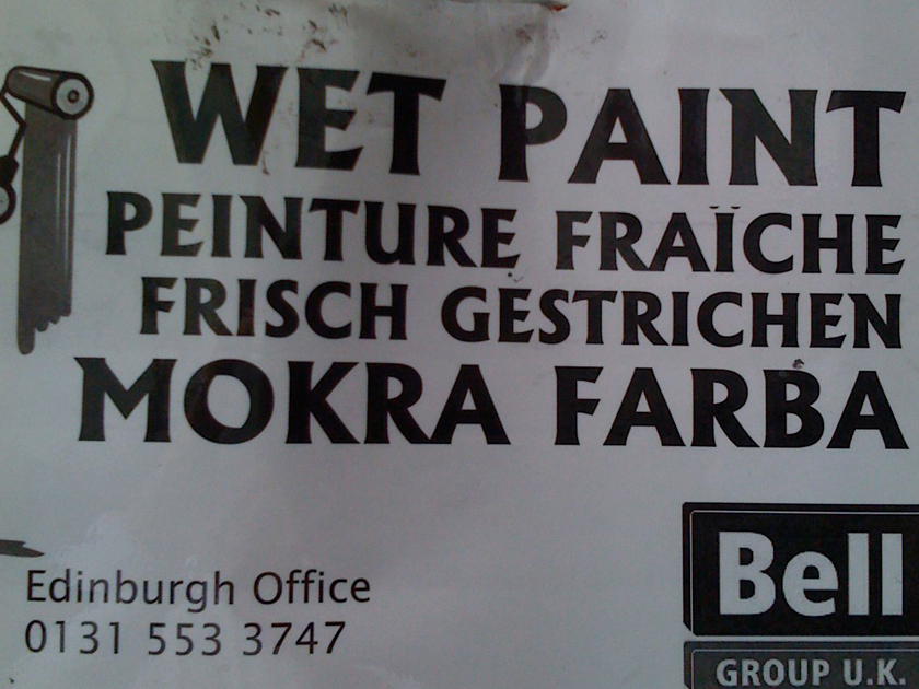 "Wet Paint"-sign from an Edinburgh office comes in four languages "Wet Paint"-sign from an Edinburgh office comes in four languages