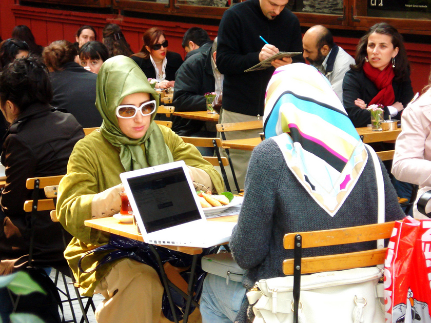 Two young Muslim women in the heart of Istanbul with their laptop Two young Muslim women in the heart of Istanbul with their laptop